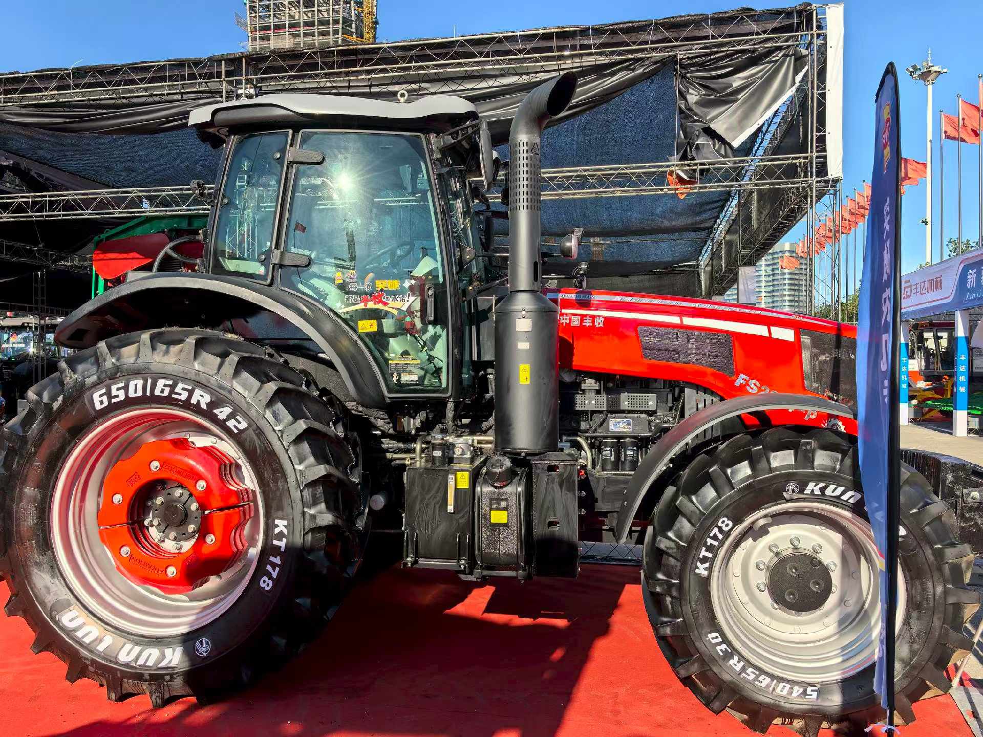 Red agricultural tractor fitted with KUNLUN agricultural tires