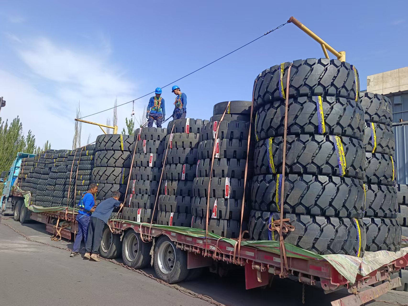 Workers securing tires for shipment at the factory